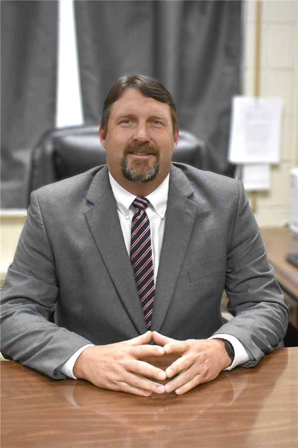 Mr. Lowe at desk